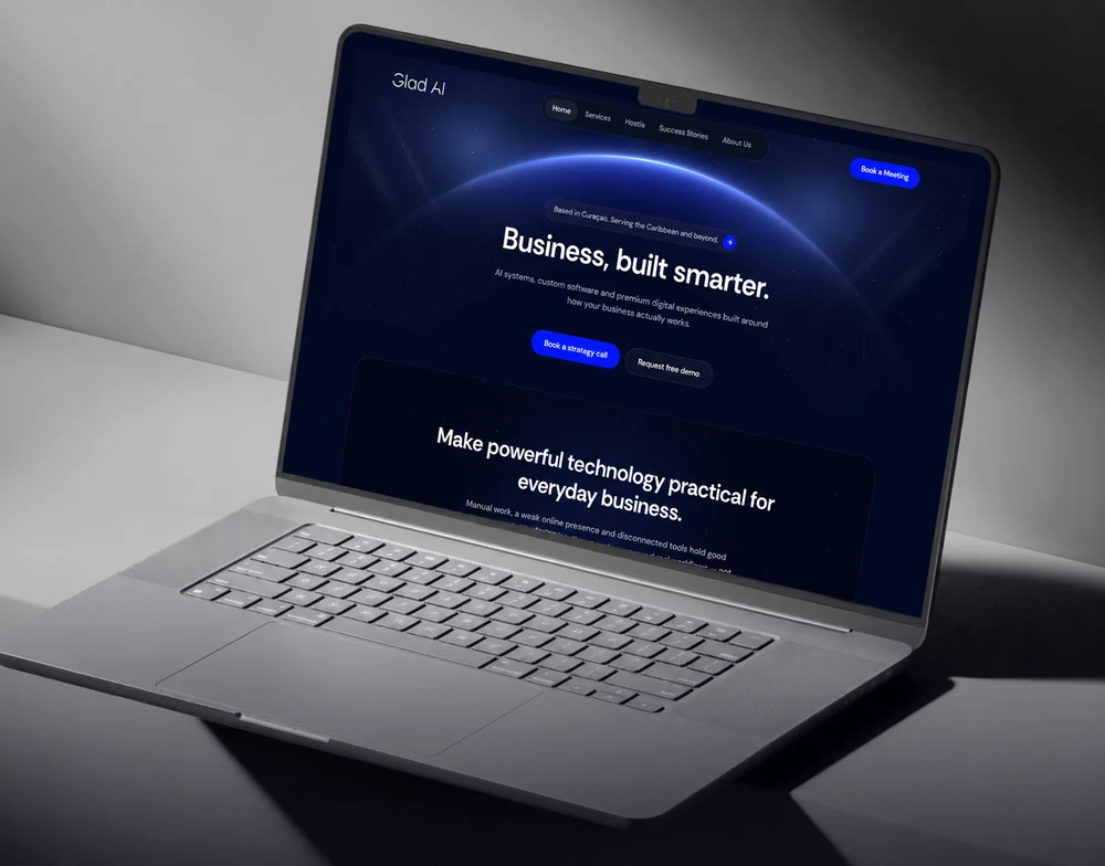 A laptop showing the Glad AI homepage, with its hero arc and "Business, built smarter." headline.